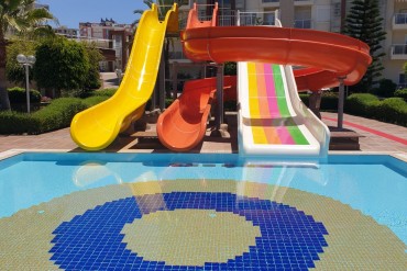 The surface of the water slides in the outdoor pool was repaired and repainted
